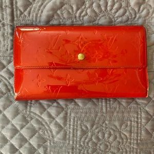 Louis Vuitton red patent wallet.